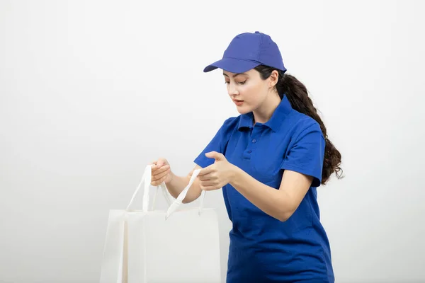 Beautiful Female Courier Blue Outfit Showing White Bags High Quality — Stock Photo, Image