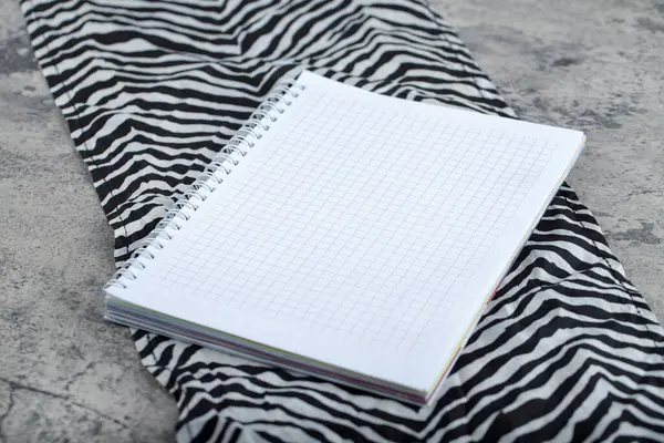 Empty Notebook Striped Tablecloth Placed Stone Background High Quality Photo — 图库照片