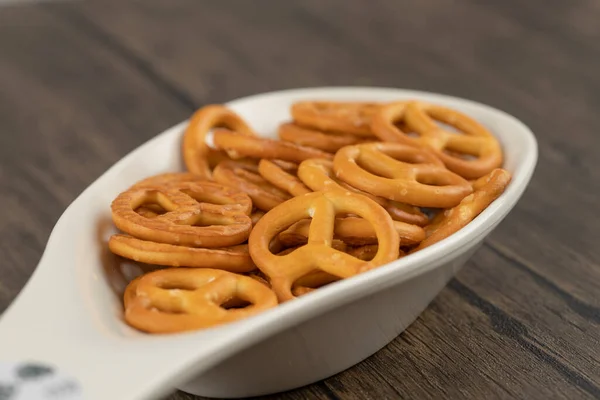 White Spoon Full Salty Cracker Pretzels Placed Wooden Table High — Stock Photo, Image