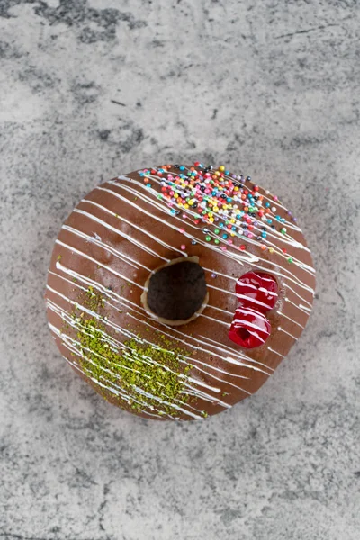 Delicious Chocolate Glazed Donut Sprinkles Stone Background High Quality Photo — Stock Photo, Image