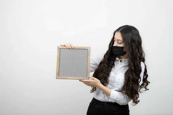 Shot Young Beautiful Girl Black Face Mask Holding Frame High — Stock Photo, Image