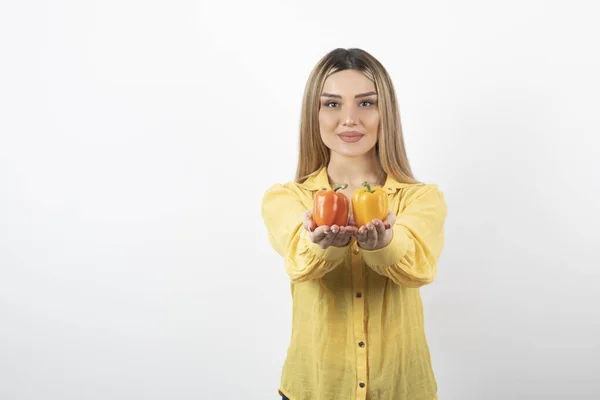 Portrait Positive Woman Offering Colorful Bell Peppers White Wall High — Stock Photo, Image