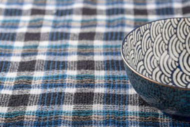 Empty colorful soup plate on dark grey background. High quality photo