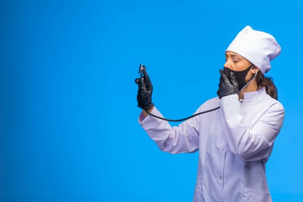 Young Nurse Black Face Mask Hand Gloves Checks Patient Stethoscope — Stock Photo, Image