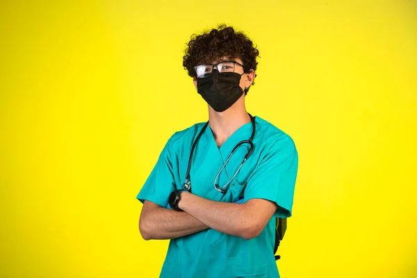 Curly Hair Boy Medical Uniform Face Mask Standing Confident Position — Stock Photo, Image