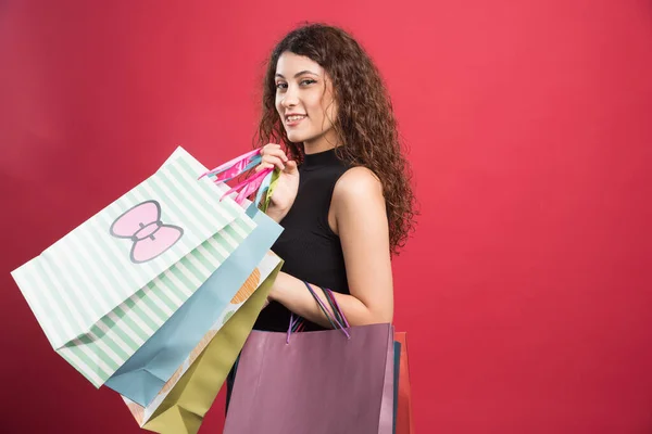 Woman Showing Her New Buying Clothes Red Background High Quality — Stock Photo, Image