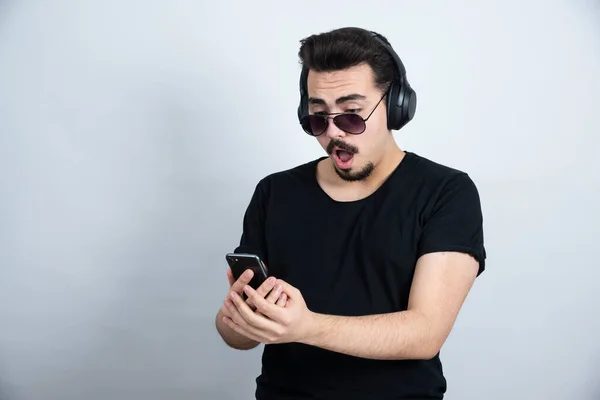 Brunette Man Model Sunglasses Headphones Holding Mobile Phone High Quality — Stock Photo, Image