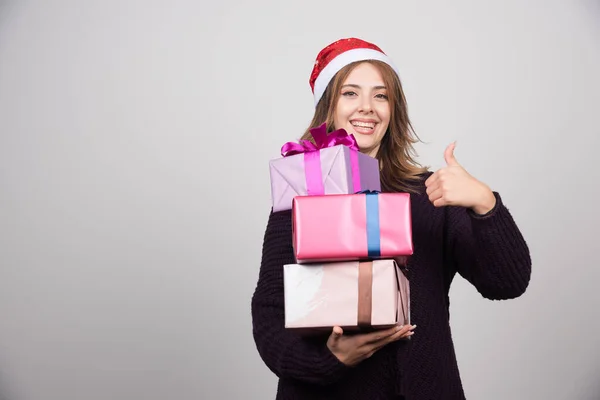 Young Woman Santa Hat Gift Boxes Showing Thumb High Quality — Stock Photo, Image