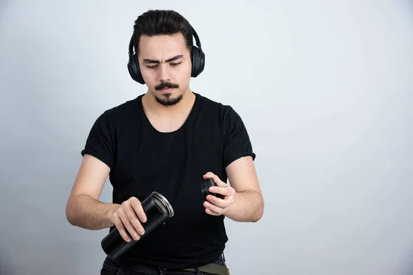 Brunette Man Model Headphones Holding Cup White Wall High Quality — Stock Photo, Image