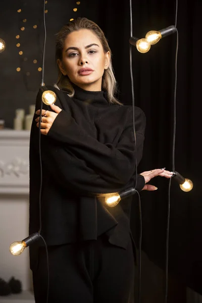 Portrait Beautiful Woman Looking Camera Dark Sweater Standing Lamps High — Stock Photo, Image