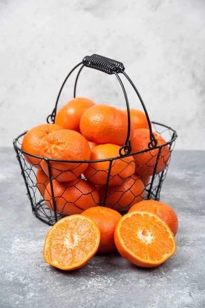 Metallic Black Basket Full Juicy Orange Fruit Stone Background High — Stock Photo, Image