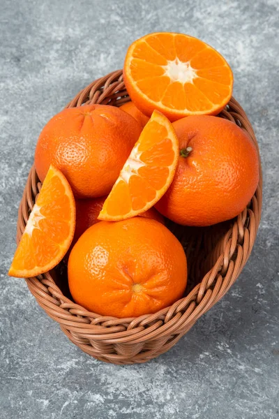 Whole Slice Juicy Fresh Orange Fruits Wicker Basket Placed Stone — Stock Photo, Image