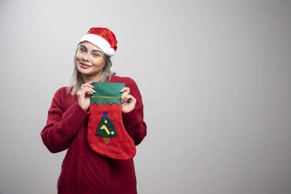 Woman Red Outfit Showing Christmas Stocking High Quality Photo — Stock Photo, Image