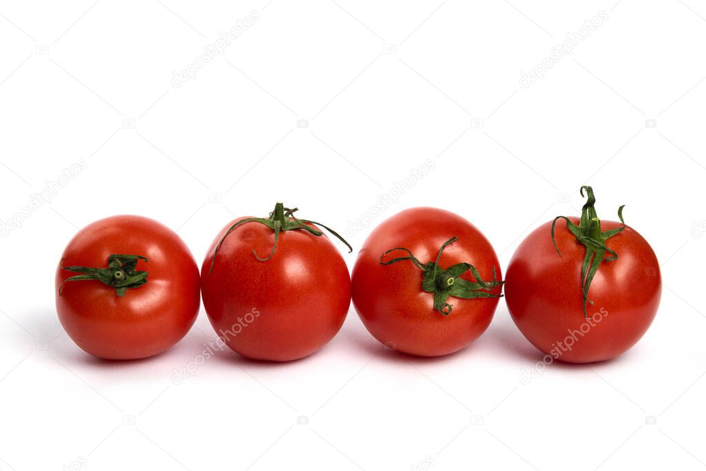 Big red fresh tomatoes on a white background. High quality photo