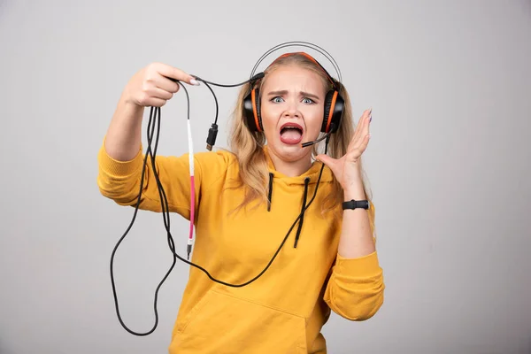 Funny Young Girl Yellow Hoodie Posing Headphones High Quality Photo — Stock Photo, Image