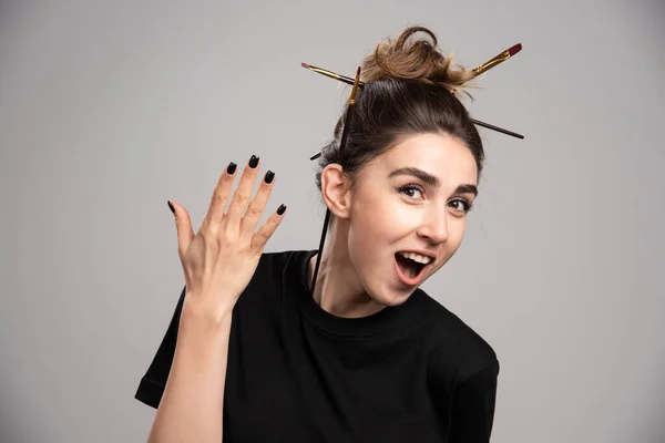 Young woman showing her messy hair. High quality photo