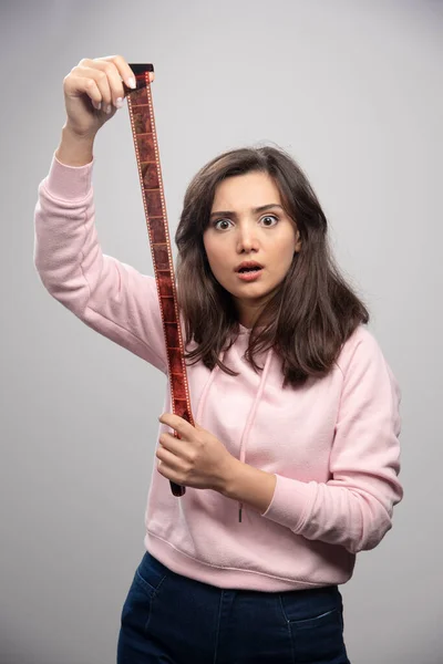 Young Photographer Looking Filmstrip Shockingly High Quality Photo — Stock Photo, Image