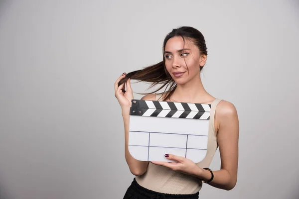 Elegant Woman Holding Clapperboard Playing Hair High Quality Photo — Stock Photo, Image