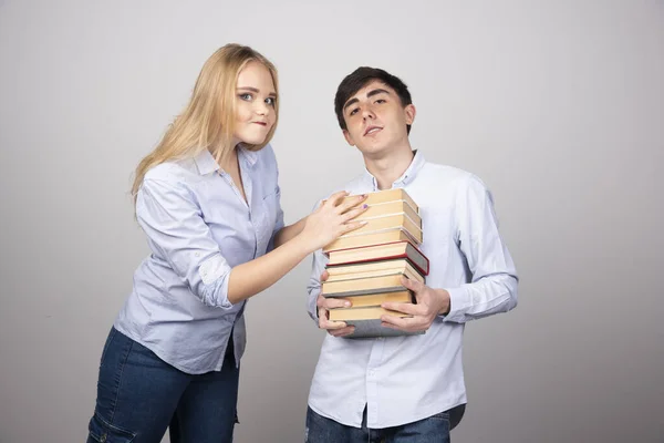 Young Man Holding Literature Books His Partner Hands Them High — Stock Photo, Image