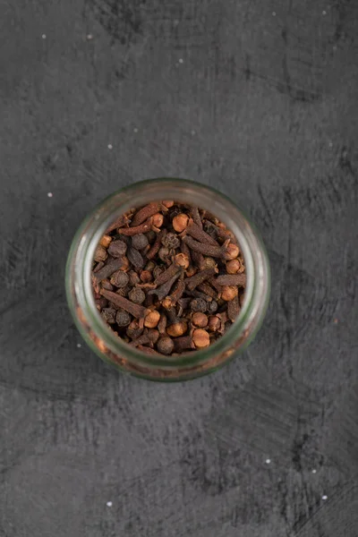 Pile Dried Natural Cloves Glass Jar Black Surface High Quality — Stock Photo, Image