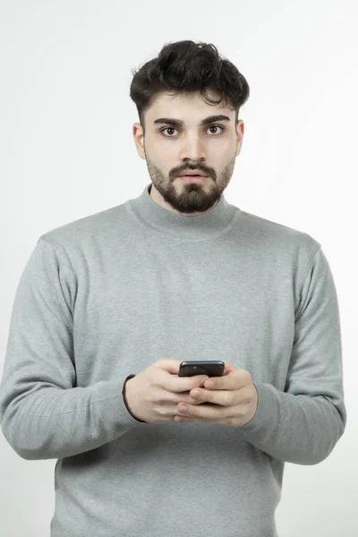 Portrait Attractive Guy Holding Smart Phone White Wall High Quality — Stock Photo, Image
