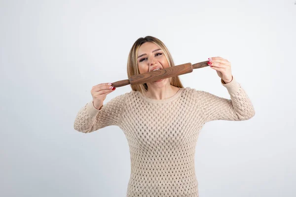 Young Female Model Biting Wooden Rolling Pin Standing White High — Stock Photo, Image