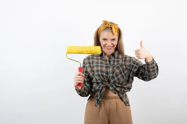 Pretty Blonde Woman Holding Yellow Paint Roller Showing Thumb High — Stock Photo, Image