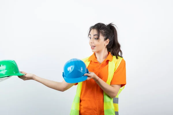 Female Worker Construction Vest Holding Hardhat High Quality Photo — Stock Photo, Image