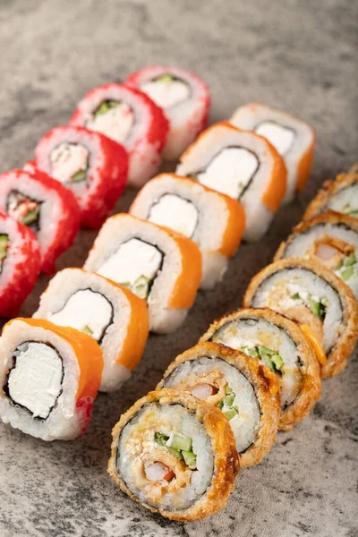 Conjunto Varios Rollos Sushi Con Pescado Fresco Sobre Fondo Piedra —  Fotos de Stock