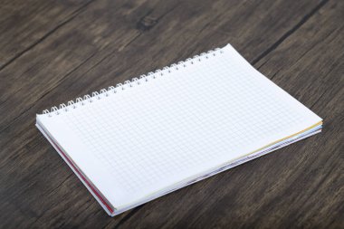 School notebook placed on a wooden background. High quality photo