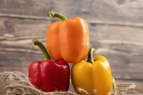 Three Colorful Bell Peppers Placed Wood Piece High Quality Photo Stock Photo