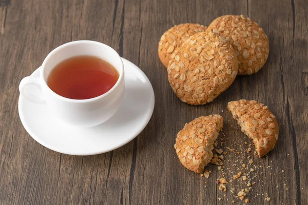 Oatmeal Cookies Seeds White Cup Black Tea Wooden Surface High — Stock Photo, Image