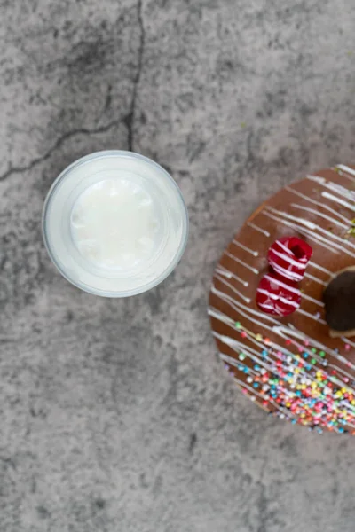 Chocolate Donut Decorated Sprinkles Glass Fresh Milk Stone Surface High — Stock Photo, Image