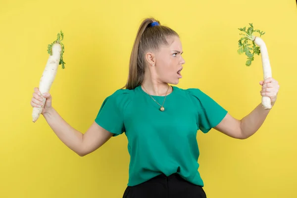 Young Beautiful Woman Holding Daikon Radishes Standing Yellow Wall High — Stock Photo, Image