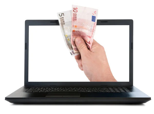 Laptop und Hand geben Euro-Banknoten — Stockfoto