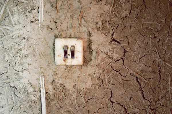 Duvardaki kirli düğmeye — Stok fotoğraf