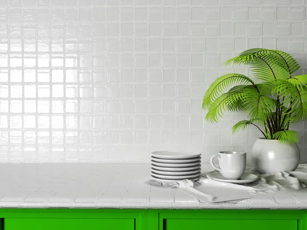 Плиты, чашка и зеленое растение на столе — стоковое фото