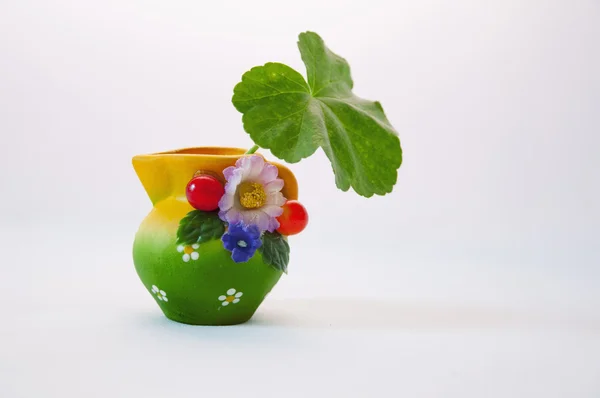 A vase with a green leaf — Stock Photo, Image