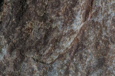 Doğal taşın dokusu yakından çekilmiş. Porselen taş ve seramik üretimi için arka plan. Stok fotoğrafçılığı