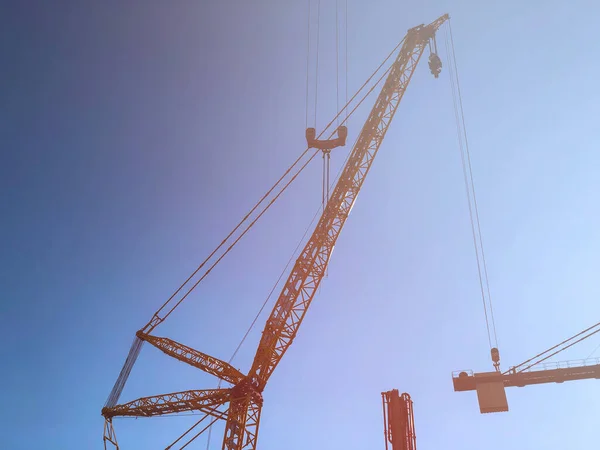 Tower Cranes Blue Sky Sun Flare Lifting Machinery Construction Site — Stock Photo, Image