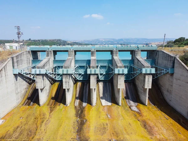 Aerial view of water reservoir and closed reservoir locks of a dam