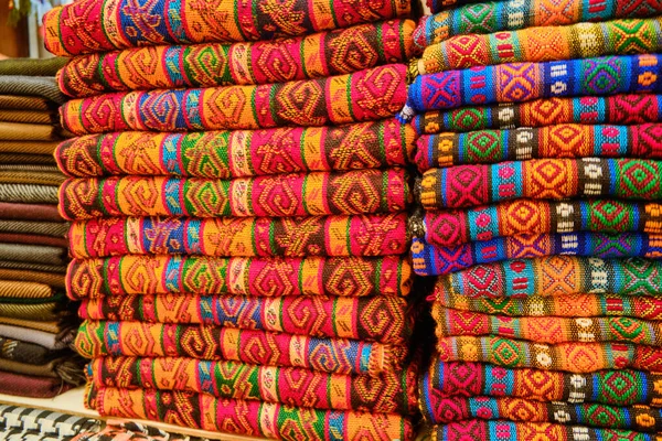 Folded colorful middle eastern carpets at bazaar — Stock Photo, Image