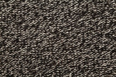 Örgü ürünün ters tarafı. Gri yün eşikli yapı