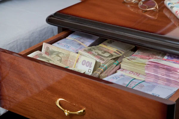 Bundles of banknotes in bedside table — Stock Photo, Image