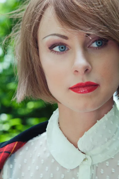 Close-up portrait of beautiful young woman in horsewoman suit in — Stock Photo, Image