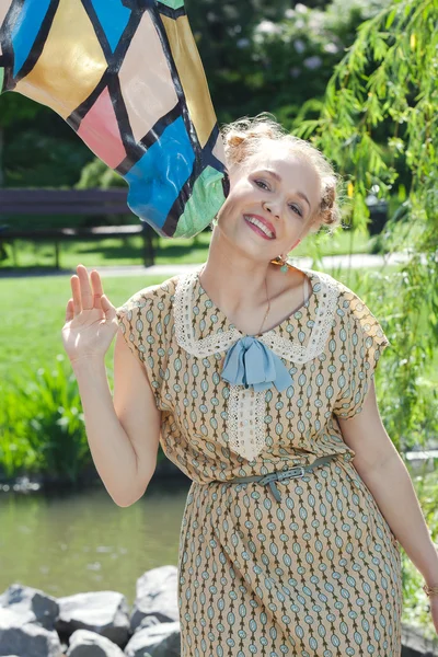 Beautiful romantic blonde girl in retro style standing near stat — Stock Photo, Image