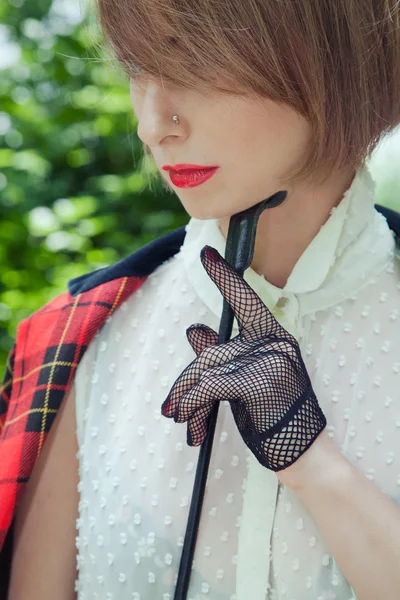 Close-up portrait of beautiful young woman in horsewoman suit in — Stock Photo, Image