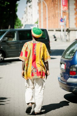 Rastaman wearing tradition al rasta hat, rear view clipart