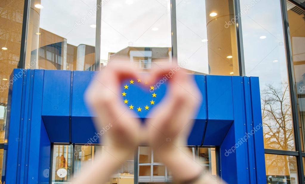 Woman hands in shape of love Europe Union Stars