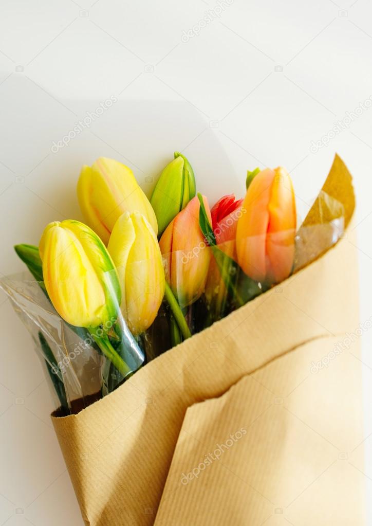 Tulip flowers bouquet warped in paper